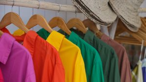 Coloured shirts on hangers